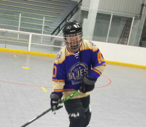 A fan wearing his LGBR jersey in a roller hockey game