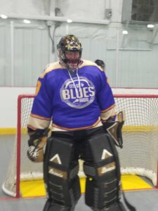 A fan wearing his LGBR jersey in a roller hockey game